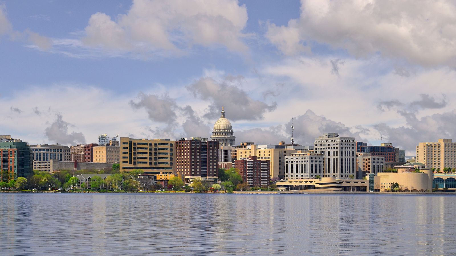 Downtown Madison across Lake Monona, with the Wisconsin State Capitol dome rising above the lakeside buildings.